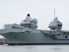 Royal Navy aircraft carrier HMS Prince of Wales will be deployed to the region at the head of a Carrier Strike Group (Andrew Matthews/PA)