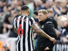 Newcastle defender Jamaal Lascelles is consoled by head coach Eddie Howe after suffering a serious knee injury (Richard Sellers/PA)
