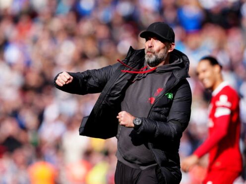 Liverpool manager Jurgen Klopp celebrates his side’s 2-1 win over Brighton which took them top of the Premier League (Peter Byrne/PA)