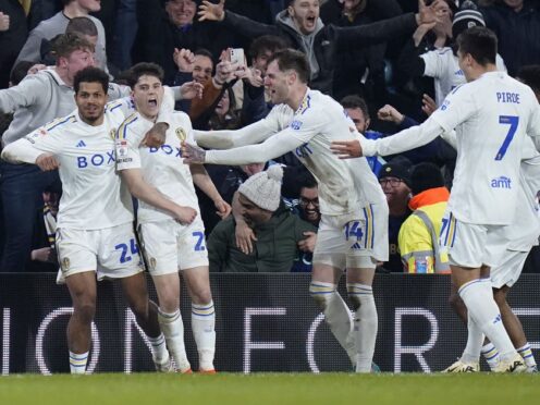 Leeds players celebrate after Daniel James, second left, scored his side’s third goal (Danny Lawson/PA)