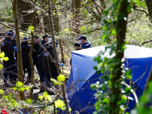 Police officers by a forensic tent at Kersal Dale, near Salford, Greater Manchester, after human remains were found (Peter Byrne/PA)