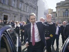 Newly elected Taoiseach Simon Harris gestures as he leaves the Dail in Dublin (Niall Carson/PA)