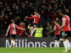Che Adams, centre, celebrates after scoring Southampton’s second goal (Steven Paston/PA)