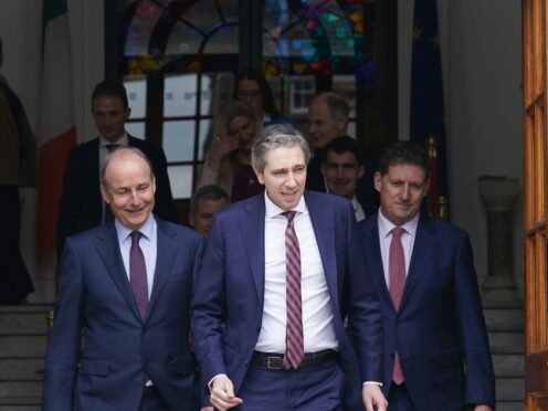 New Taoiseach Simon Harris (centre) with Tanaiste Micheal Martin (left) and Green Party Leader Eamon Ryan (right) (Brian Lawless/PA)