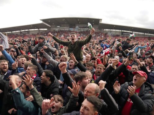 Wrexham fans celebrate their promotion (Jacob King/PA).