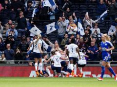 Martha Thomas is bundled by her Tottenham team-mates after her goal beat Leicester to send them through to the Women’s FA Cup final (Zac Goodwin/PA)
