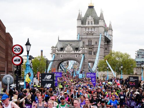 Runners cross Tower Bridge during the TCS London Marathon (Aaron Chown/PA)