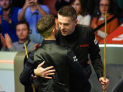 Joe O’Connor celebrates beating Mark Selby (right) on day three of the 2024 Cazoo World Snooker Championship at the Crucible Theatre, Sheffield. Picture date: Monday April 22, 2024.