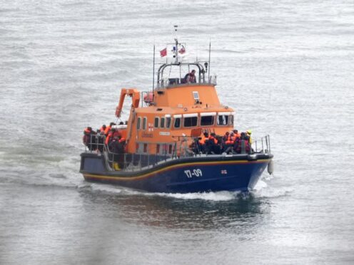 Three people have been arrested on suspicion of immigration offences after five migrants including a child died while trying to cross the Channel (Gareth Fuller/PA)