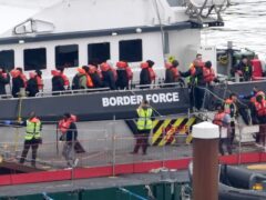 A group of people thought to be migrants are brought in to Dover, Kent, from a Border Force vessel following a small boat incident in the Channel (Gareth Fuller/PA)