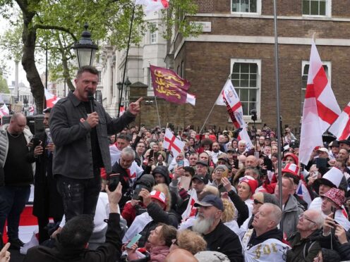 Tommy Robinson speaking during a St George’s Day rally on Whitehall, in Westminster (Jordan Pettitt/PA)