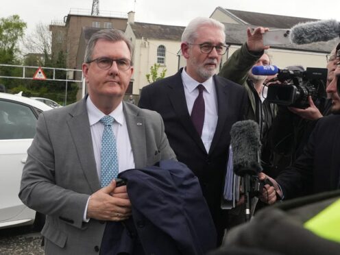 Former DUP leader Sir Jeffrey Donaldson (left) arrives at Newry Magistrates’ Court (Niall Carson/PA)