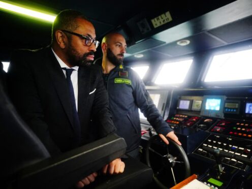 Home Secretary James Cleverly is shown a radar system during a tour of a police boat in Lampedusa Port (Victoria Jones/PA)
