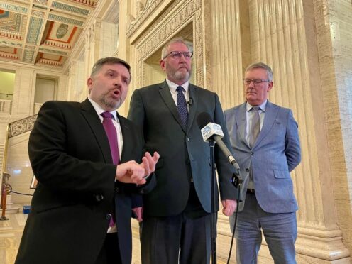 Health Minister Robin Swann (left), UUP leader Doug Beattie (centre) and UUP MLA Mike Nesbitt speaking after the Stormont Executive agreed a budget not supported by the party (David Young/PA)