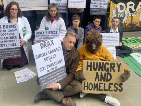Broadcaster Chris Packham and members of the Axe Drax campaign group protesting outside the Drax AGM (Merry Dickinson/PA)