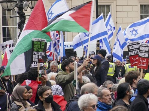 People take part in a pro-Palestine march as they walk past a counter protest (Jeff Moore/PA)