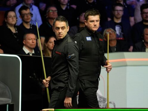 Ronnie O’Sullivan (left) and Ryan Day look at the table as the seven-time world champion carved out a 10-6 lead at the Crucible (Martin Rickett/PA)