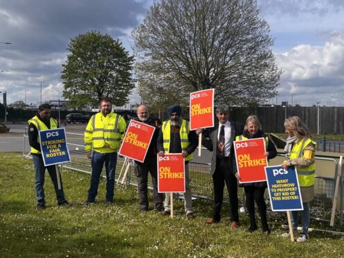 Members of the Public and Commercial Services Union on the picket line at Heathrow Airport (Jamel Smith/PA)