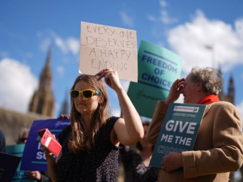 Campaigners in support of voluntary euthanasia protest outside Parliament (Jordan Pettitt/PA)