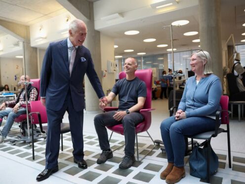 The King meets patients during a visit to University College Hospital Macmillan Cancer Centre (Suzanne Plunkett/PA)