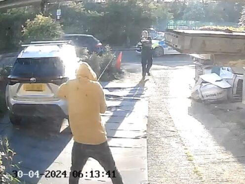Handout footage from a doorbell camera of police officers tasering and detaining a sword-wielding man in Hainault, north-east London (PA)