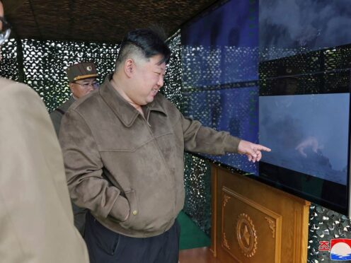 In this photo provided by the North Korean government, North Korean leader Kim Jong Un, right, supervises a drill at an undisclosed place in North Korea (Korean Central News Agency/Korea News Service via AP)