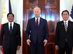 President Joe Biden, centre, Philippine President Ferdinand Marcos Jr., left, and Japanese Prime Minister Fumio Kishida pose before a trilateral meeting in the East Room of the White House in Washington (Mark Schiefelbein/AP)
