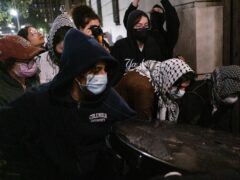 Students with the Gaza Solidarity Encampment block the entrance of Hamilton Hall at Columbia University (Marco Postigo Storel via AP)