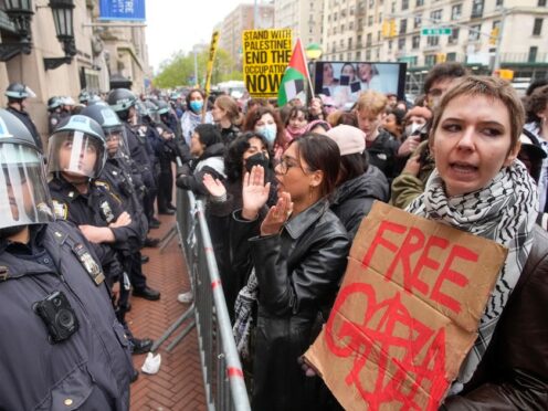 Demonstrators chant slogans outside the Columbia University campus (AP)