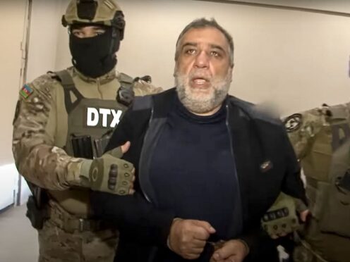 FILE – In this photo taken from video released by State Security Service of the Republic of Azerbaijan on Thursday, Sept. 28, 2023, Ruben Vardanyan, the former head of Nagorno-Karabakh’s separatist government, center, is escorted by Azerbaijani security service agents in Baku, Azerbaijan. Vardanyan, a former Ruben Vardanyan (State Security Service of the Republic of Azerbaijan via AP, File)