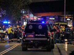 Emergency officers outside Westfield Shopping Centre in Sydney (Rick Rycroft/PA)