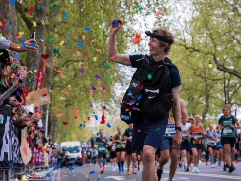 George Scholey has broken the world record for the most Rubik’s Cubes solved while running a marathon (Jonny Davies/Jike Media/PA)