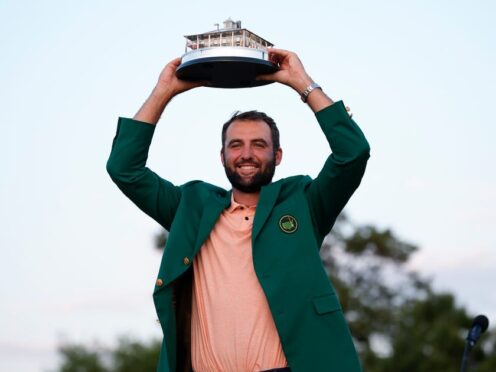 Scottie Scheffler holds the trophy after winning the Masters golf tournament at Augusta National Golf Club (Matt Slocum/AP)