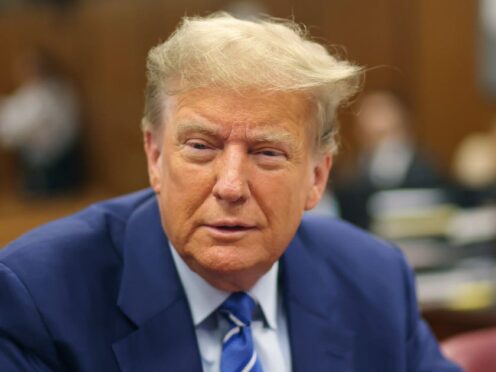 Former US president Donald Trump awaits the start of proceedings on the second day of jury selection at Manhattan Criminal Court in New York (Michael M Santiago/Pool Photo via AP)