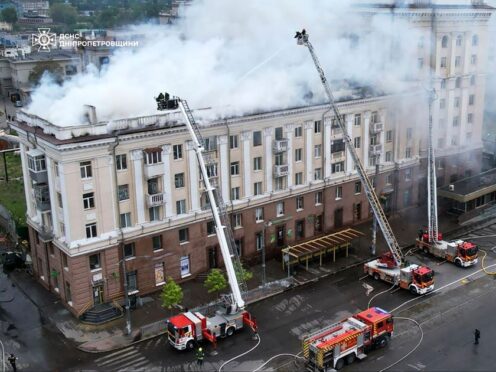 Rescuers work on the scene of a building damaged after a Russian attack in Dnipro (Ukrainian Emergency Service via AP Photo)