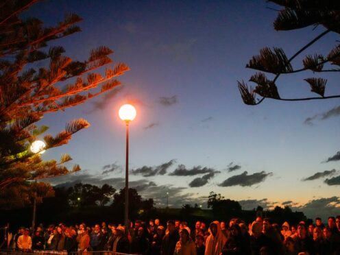 Crowds attend the Anzac Day dawn service at Coogee Beach in Sydney (Mark Baker/AP)