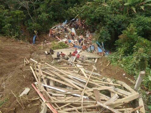 Rescuers search for survivors at a village hit by a landslide in Tana Toraja district of South Sulawesi province, Indonesia (National Search and Rescue Agency via AP)