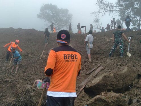 Rescuers search for victims of a landslide in Tana Toraja, South Sulawesi, Indonesia (BPBD Tana Toraja via AP)