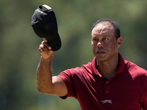 Tiger Woods waves to spectators after his final round in the 88th Masters (David J Phillip/AP)