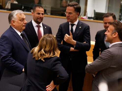 Hungary’s Prime Minister Viktor Orban, Malta’s Prime Minister Robert Abela, Netherland’s Prime Minister Mark Rutte, Portugal’s Prime Minister Luis Montenegro, French President Emmanuel Macron and Italy’s Prime Minister Giorgia Meloni speak during a round table meeting at an EU summit in Brussels (Omar Havana/AP)