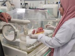 A Palestinian baby girl, Sabreen Jouda, who was delivered prematurely after her mother was killed in an Israeli strike, lies in an incubator in the Emirati hospital (Mohammad Jahjouh/AP)