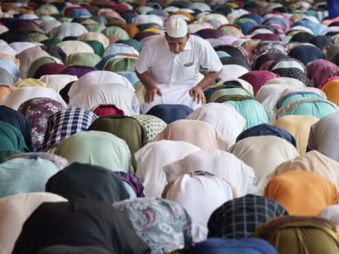 Muslims offer prayers for the Eid al-Fitr in Kuala Lumpur, Malaysia (Vincent Thian/AP)
