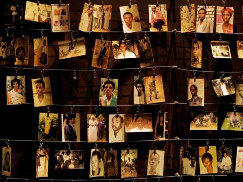 Family photographs of some of those who died hang on display in an exhibition at the Kigali Genocide Memorial centre in the capital Kigali, Rwanda (Ben Curtis/AP)