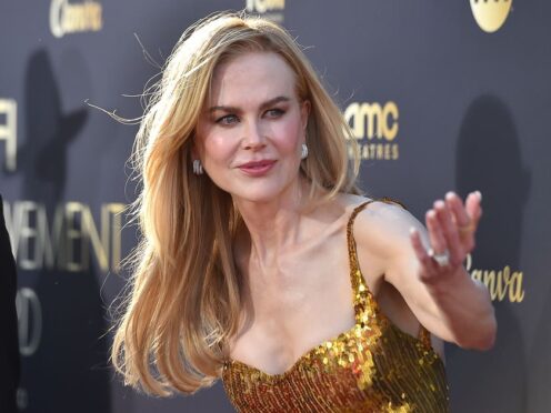 Nicole Kidman wore a glittering golden gown for the ceremony (Jordan Strauss/Invision/AP)