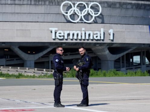Gendarmes in front of the Charles de Gaulle airport (Thibault Camus/AP)