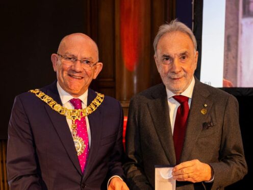 The medal was awarded to the institute’s director Giuseppe Remuzzi, right (Duncan McGlynn/PA)