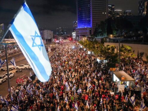 People protest in Tel Aviv on Saturday against Israeli Prime Minister Benjamin Netanyahu’s government and call for the release of hostages held in the Gaza Strip (Ohad Zwigenberg/AP)