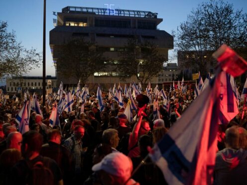 People take part in a protest against Israeli Prime Minister Benjamin Netanyahu’s government (Leo Correa/AP)