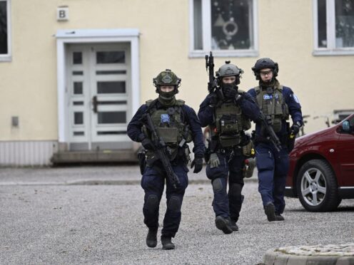 Police officers at the scene of Viertola comprehensive school, in Vantaa, Finland where three were wounded in a shooting (Markku Ulander/Lehtikuva via AP)
