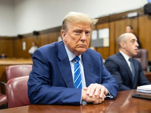 Former US president Donald Trump awaits the start of proceedings on the second day of jury selection at Manhattan Criminal Court in New York (Justin Lane/Pool Photo via AP)